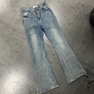 Rise blue denim bell-bottom jeans with a skinny fit